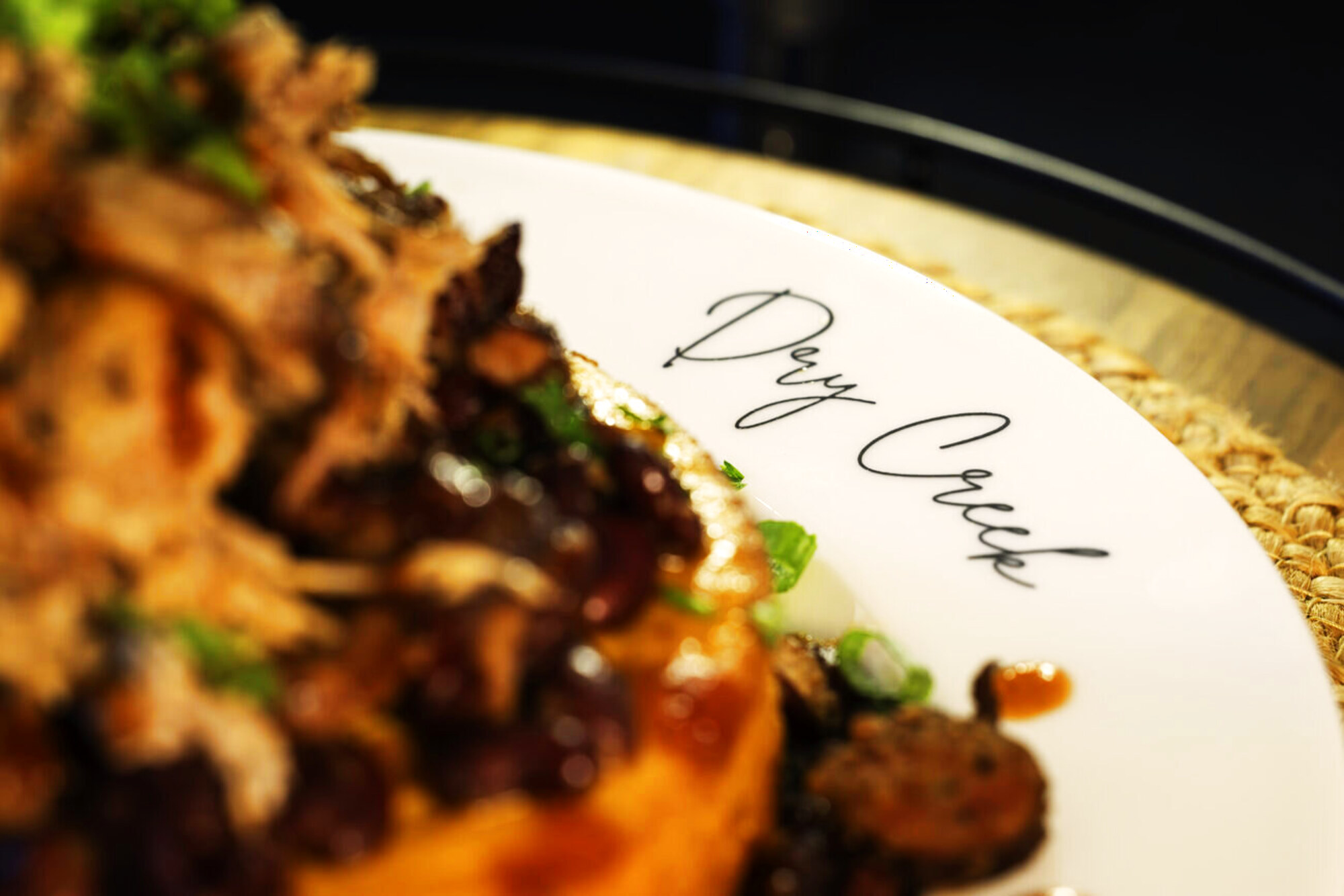 Plated wild game on a Dry Creek-branded plate