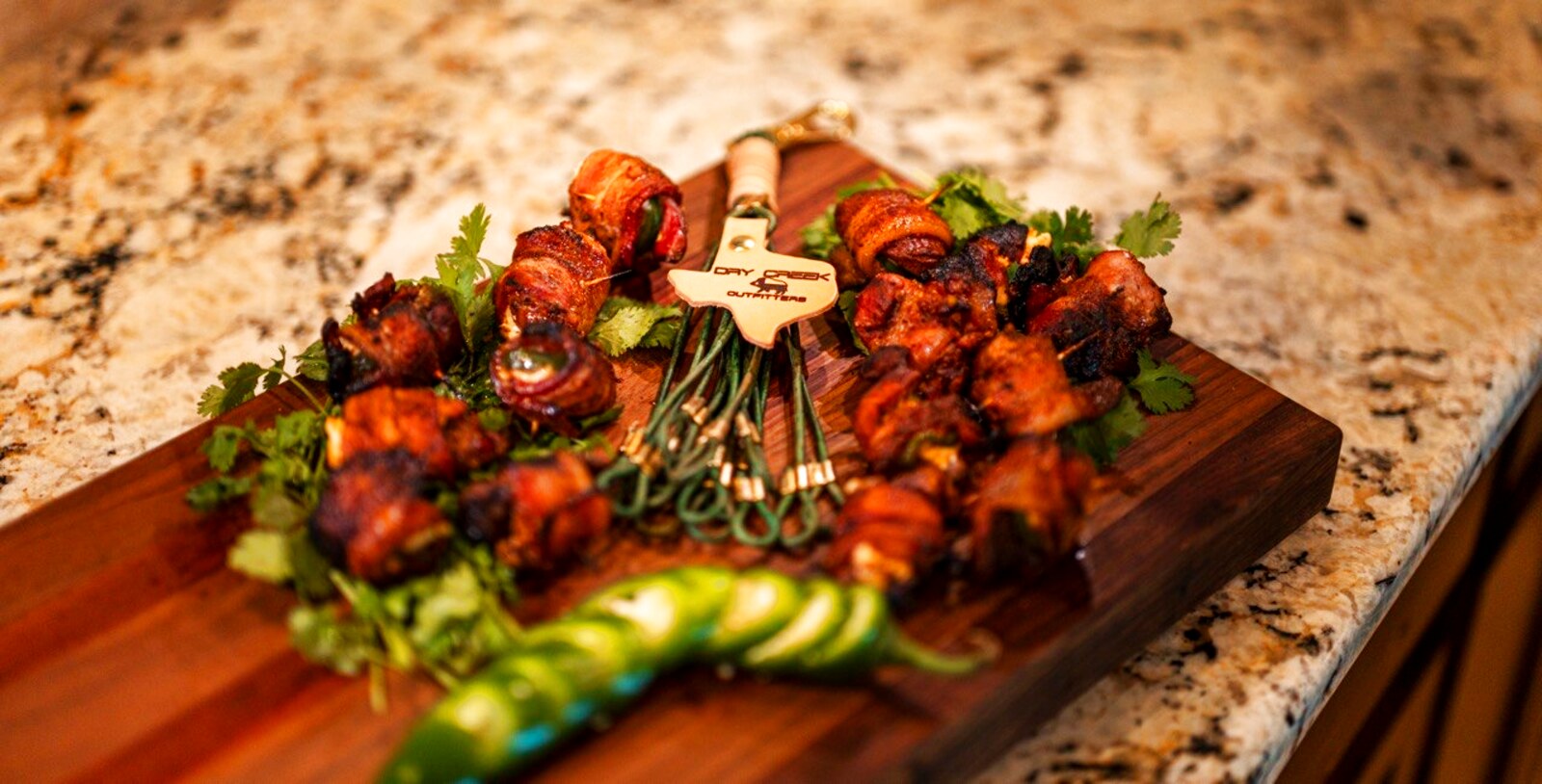 Bacon-wrapped jalapeno poppers on a board