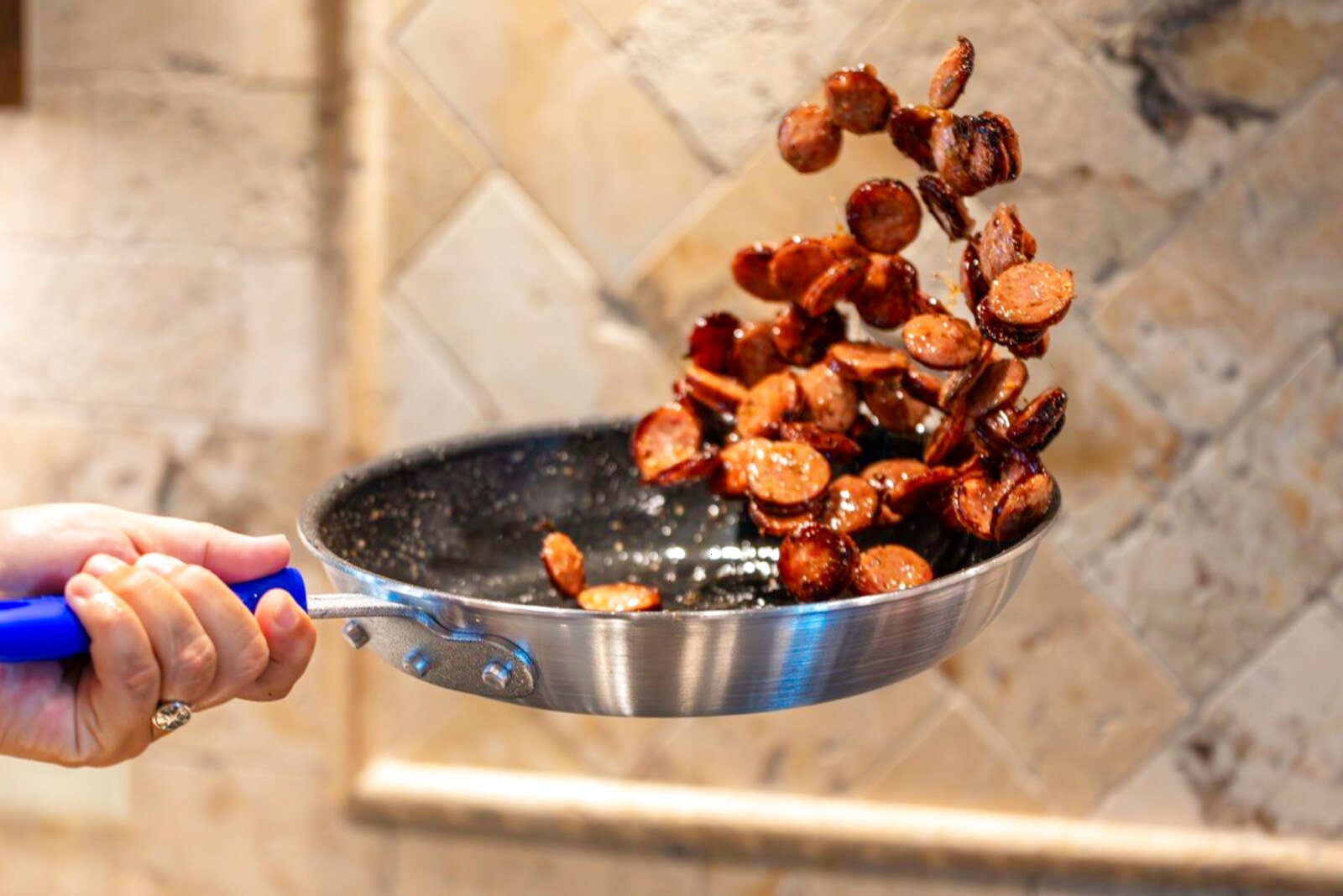Searing vegetables tossed in a pan