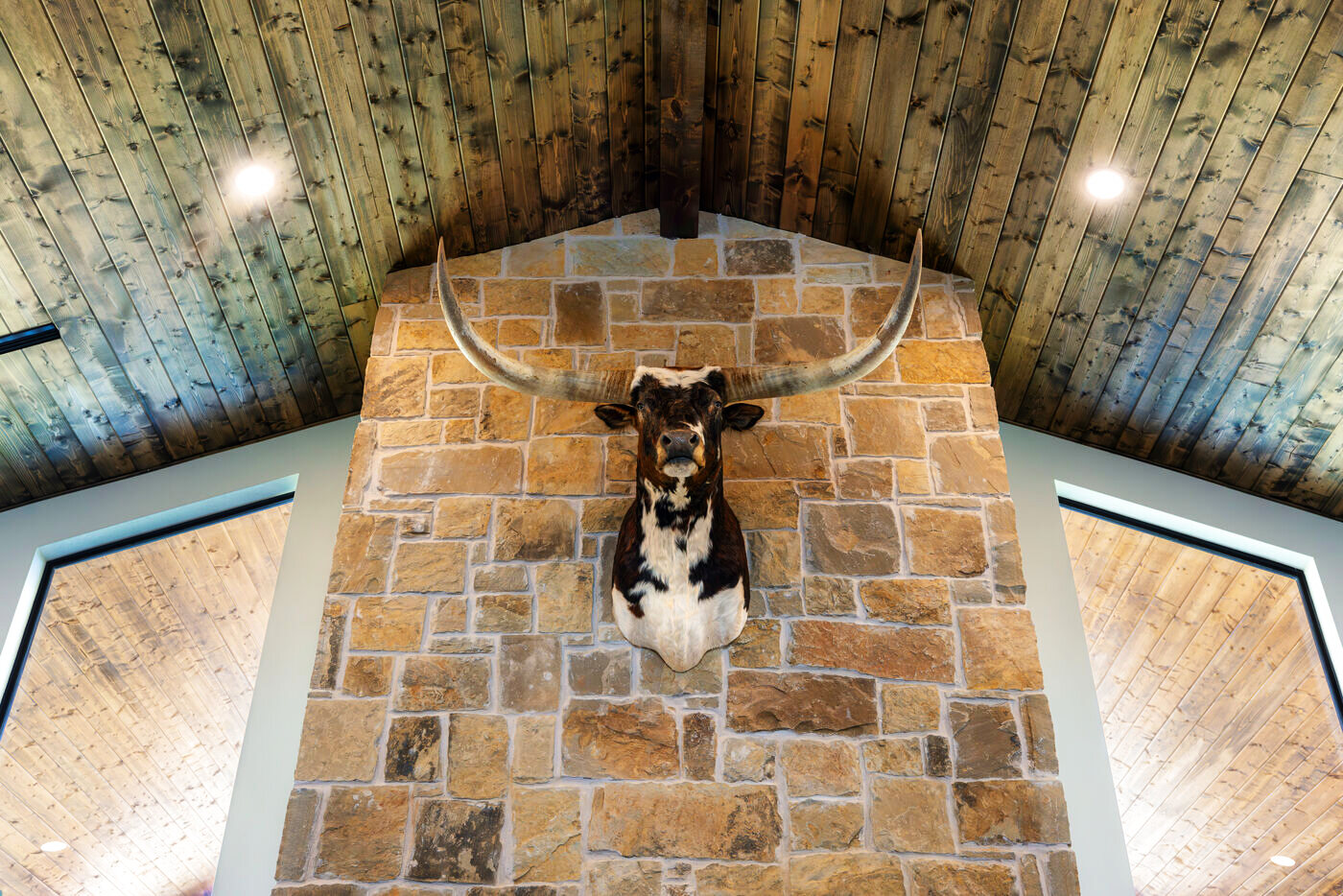 Stone fireplace with a longhorn mount