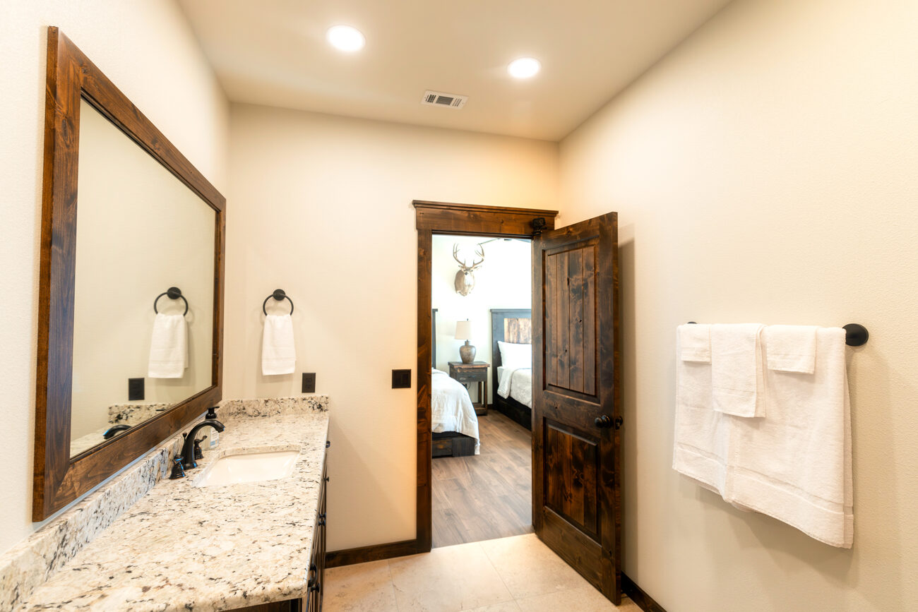 A bathroom vanity with mirror