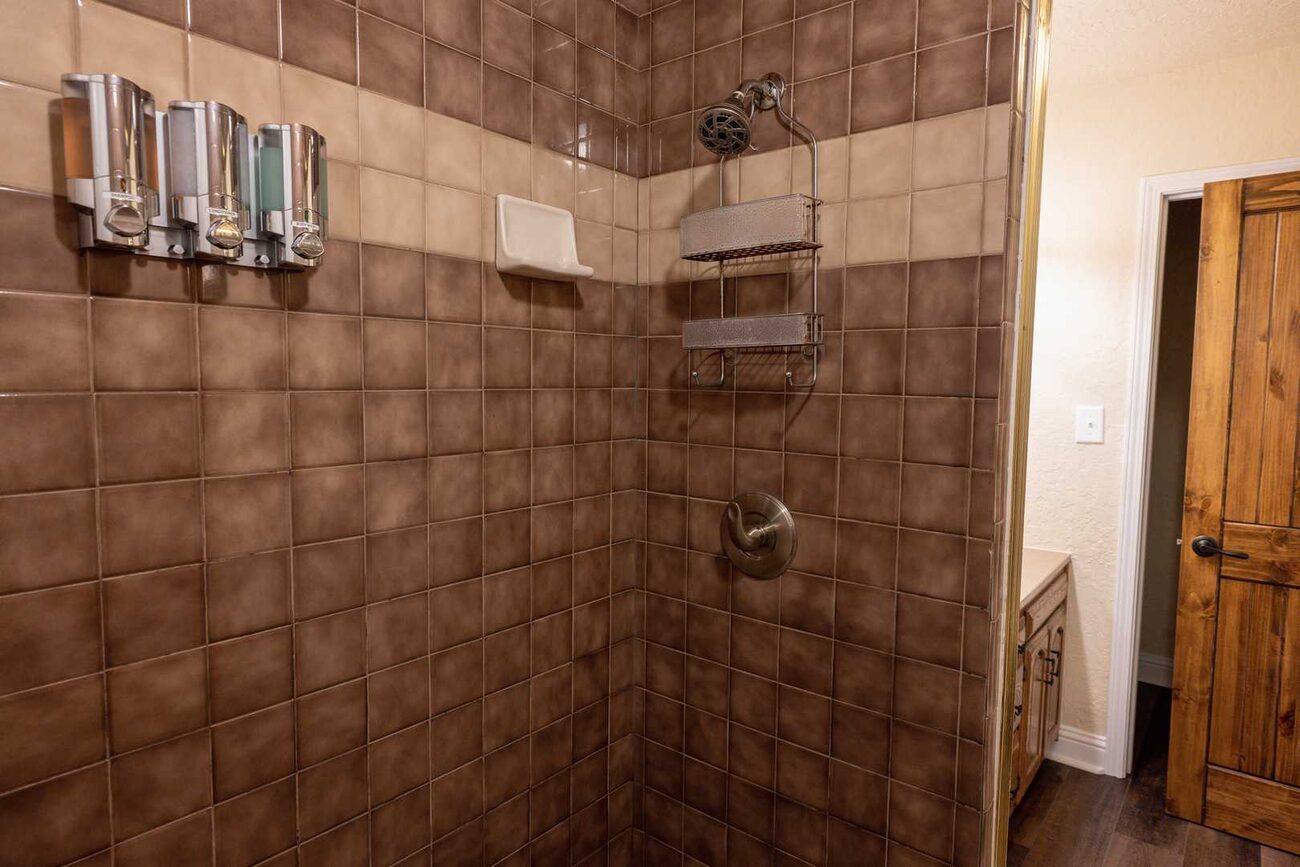 A tiled walk-in shower at Pecan Creek